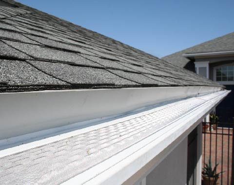 roof gutter being cleaned