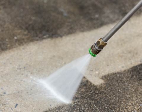 Pressure washing a balcony